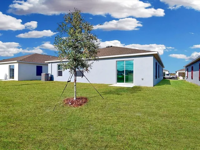 a view of a lake with houses in the back