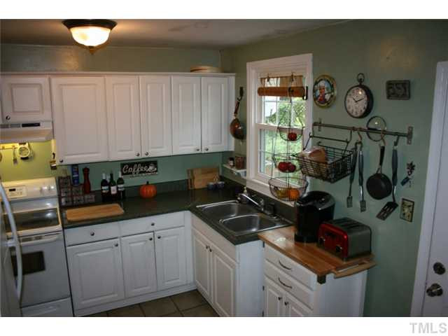 2104 Ruffin Street Durham, NC 27704 - Photo 7 of 18 Another view of the kitchen and door leading to the back yard. Kitchen