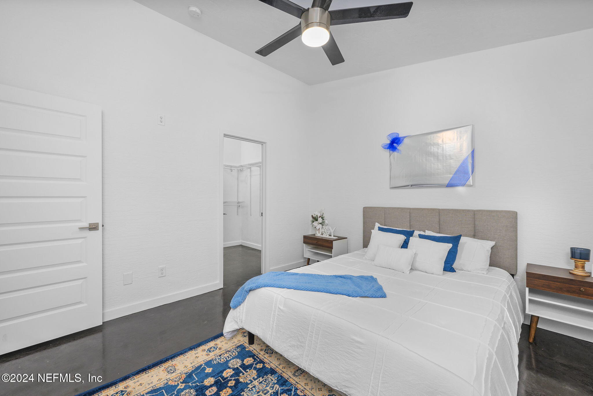 1409 High Street Palatka, FL 32177 - Photo 13 of 23 a bedroom with a bed and a painting on the wall