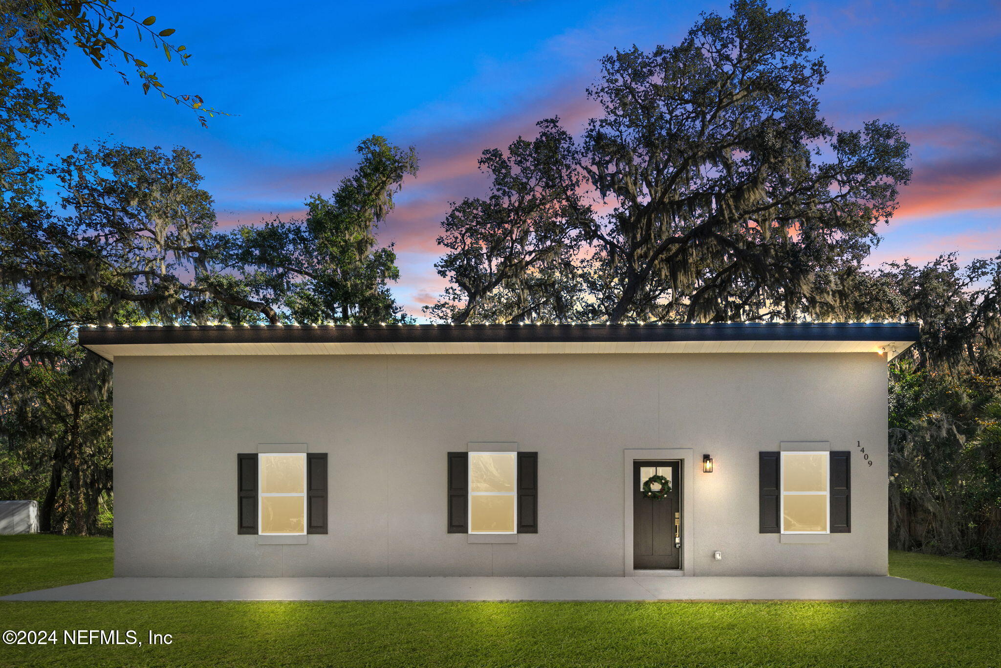 1409 High Street Palatka, FL 32177 - Photo 18 of 23 front view of house with a yard