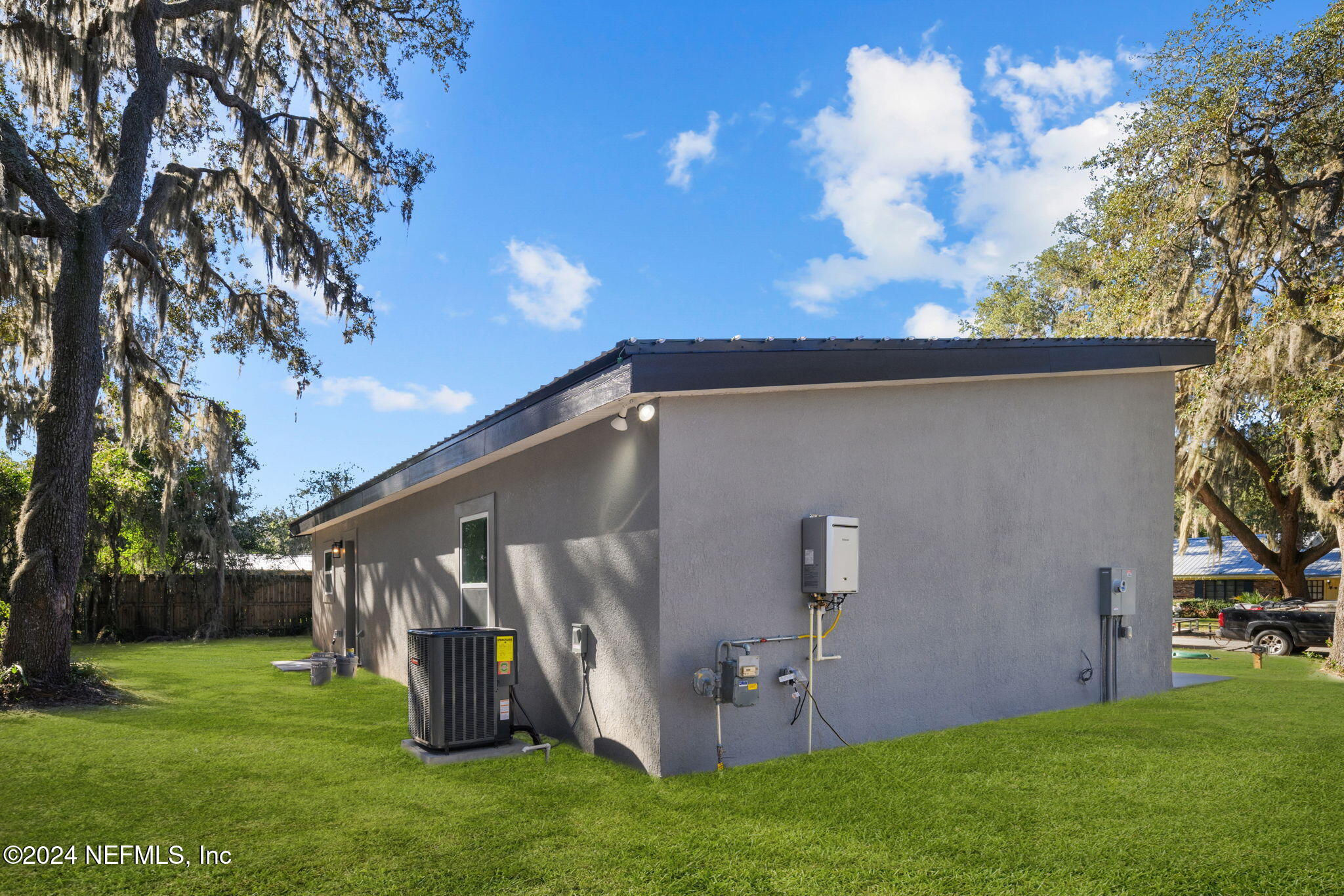 1409 High Street Palatka, FL 32177 - Photo 22 of 23 a backyard of a house with lots of green space and outdoor seating