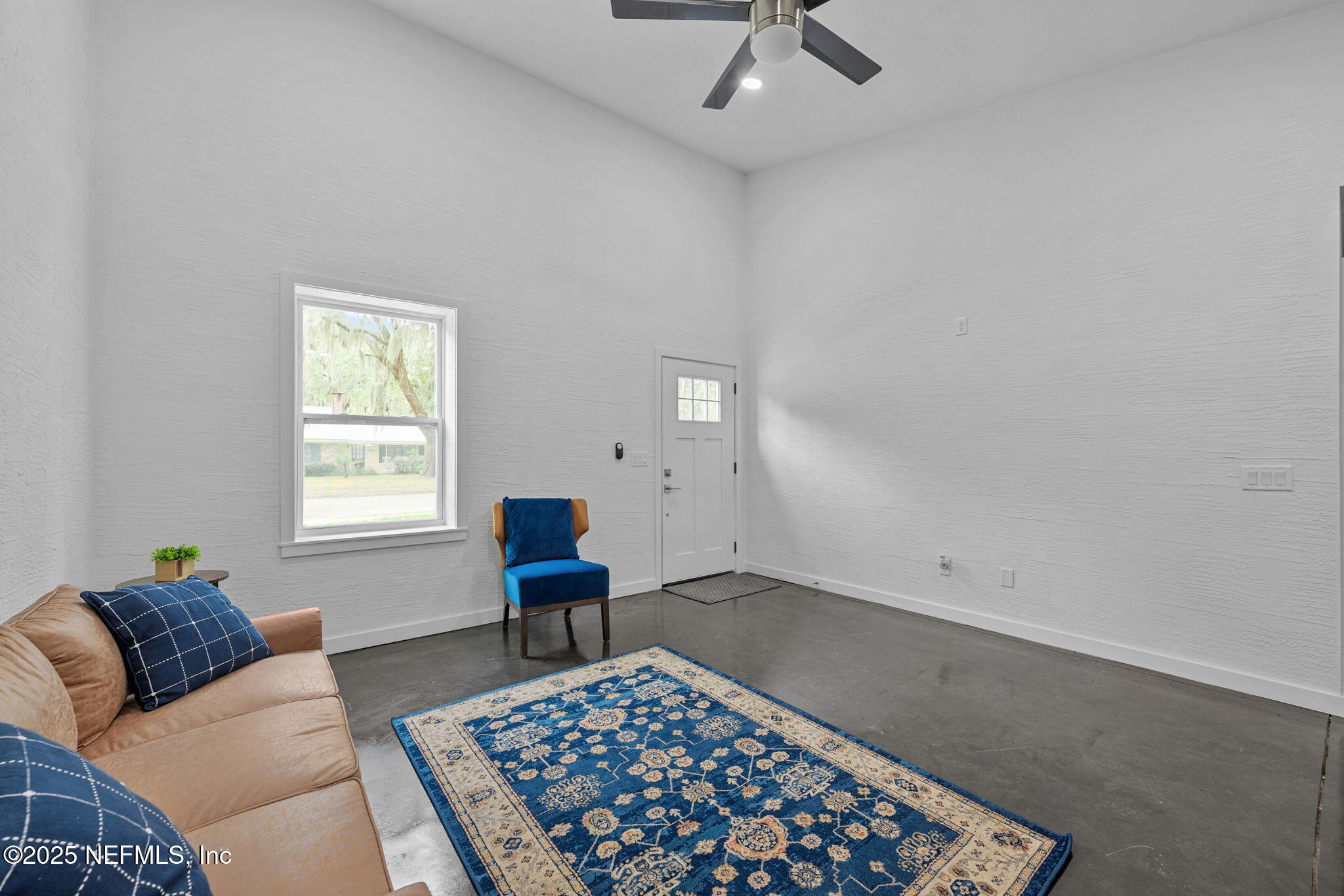 1409 High Street Palatka, FL 32177 - Photo 4 of 23 a living room with furniture and a rug
