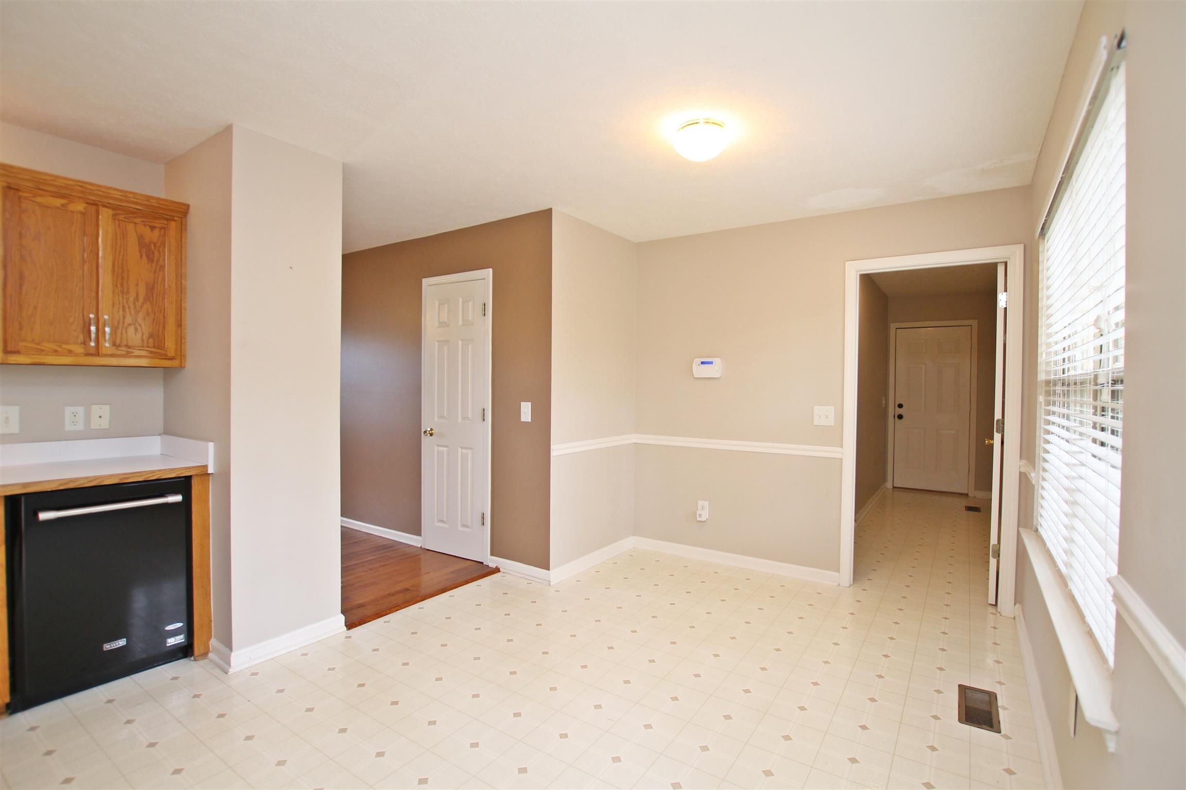 808 Hunters Crossing Lane Springfield, TN 37172 - Photo 11 of 30 a view of an empty room with wooden floor and a window