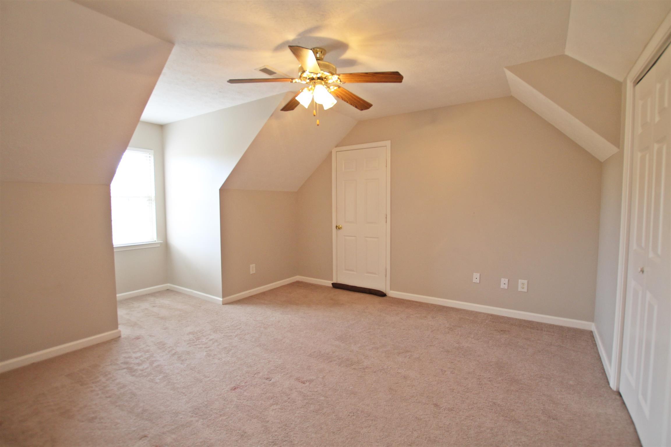 808 Hunters Crossing Lane Springfield, TN 37172 - Photo 18 of 30 an empty room with closet and a chandelier fan