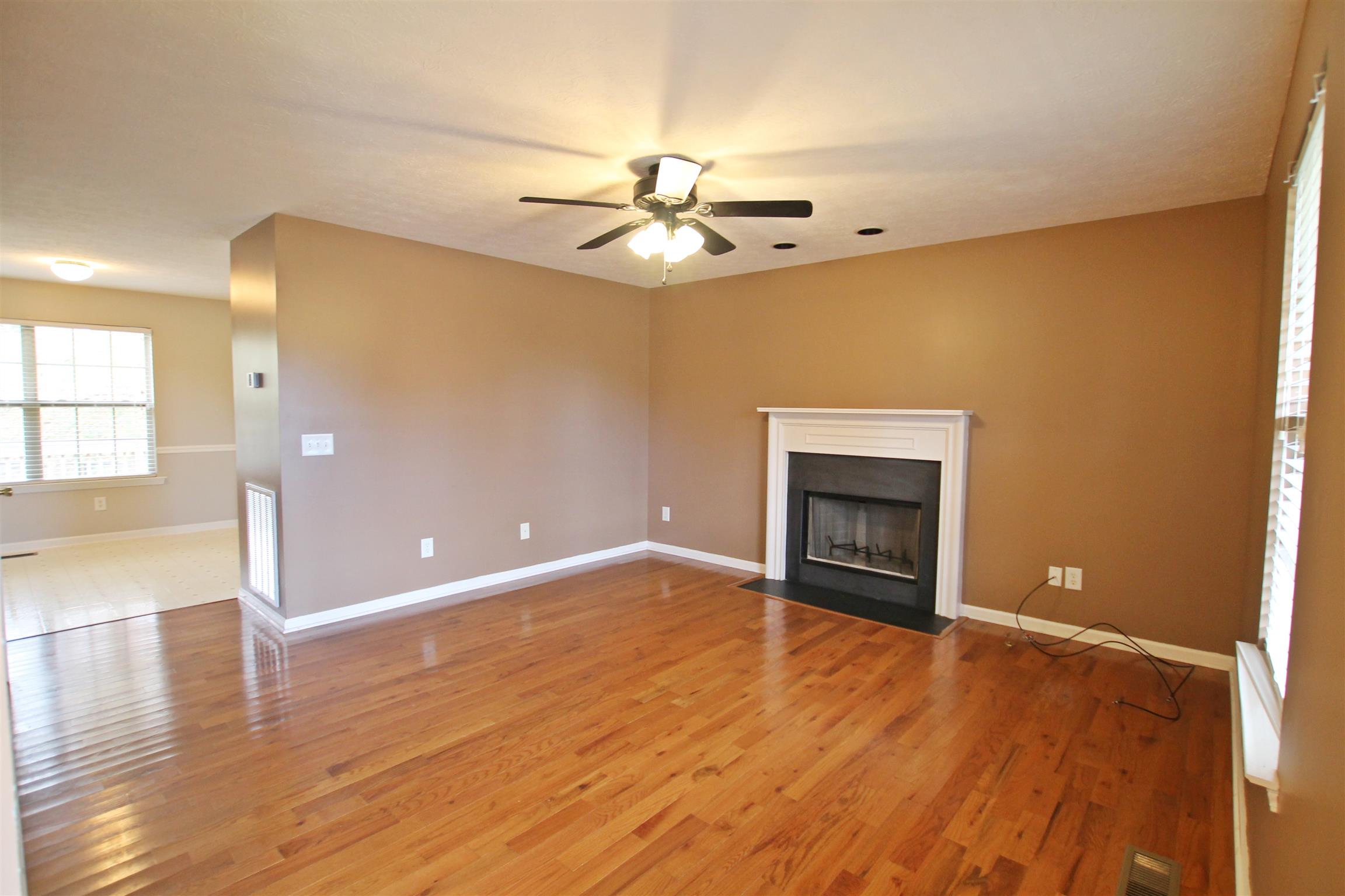 808 Hunters Crossing Lane Springfield, TN 37172 - Photo 3 of 30 a view of an empty room with a window and fireplace