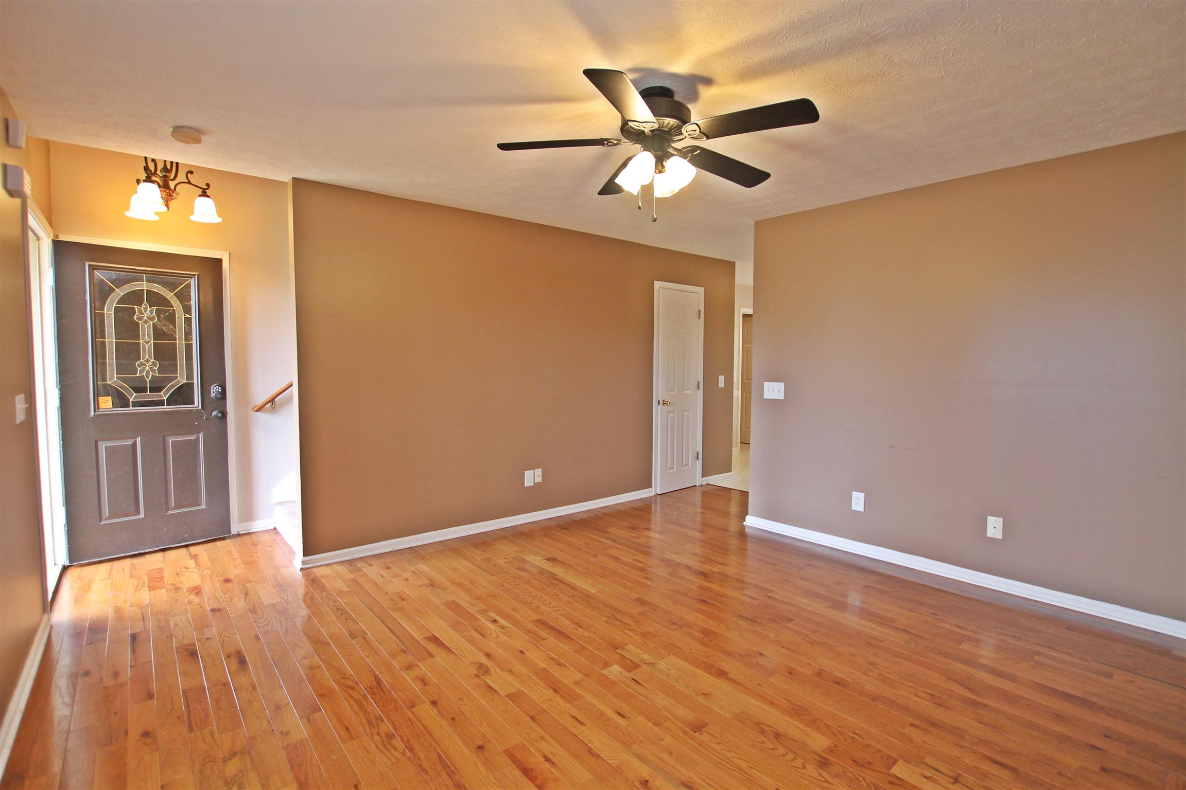 808 Hunters Crossing Lane Springfield, TN 37172 - Photo 4 of 30 a view of an empty room with window and wooden floor