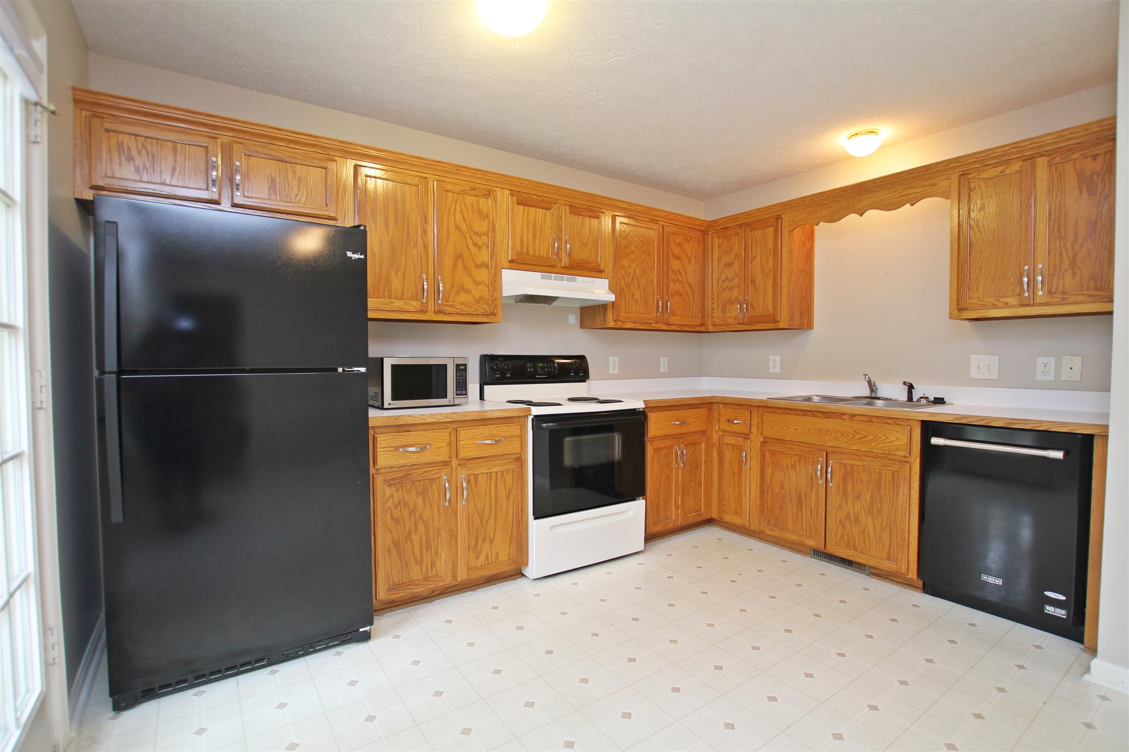808 Hunters Crossing Lane Springfield, TN 37172 - Photo 7 of 30 a kitchen with a refrigerator sink and stove top oven