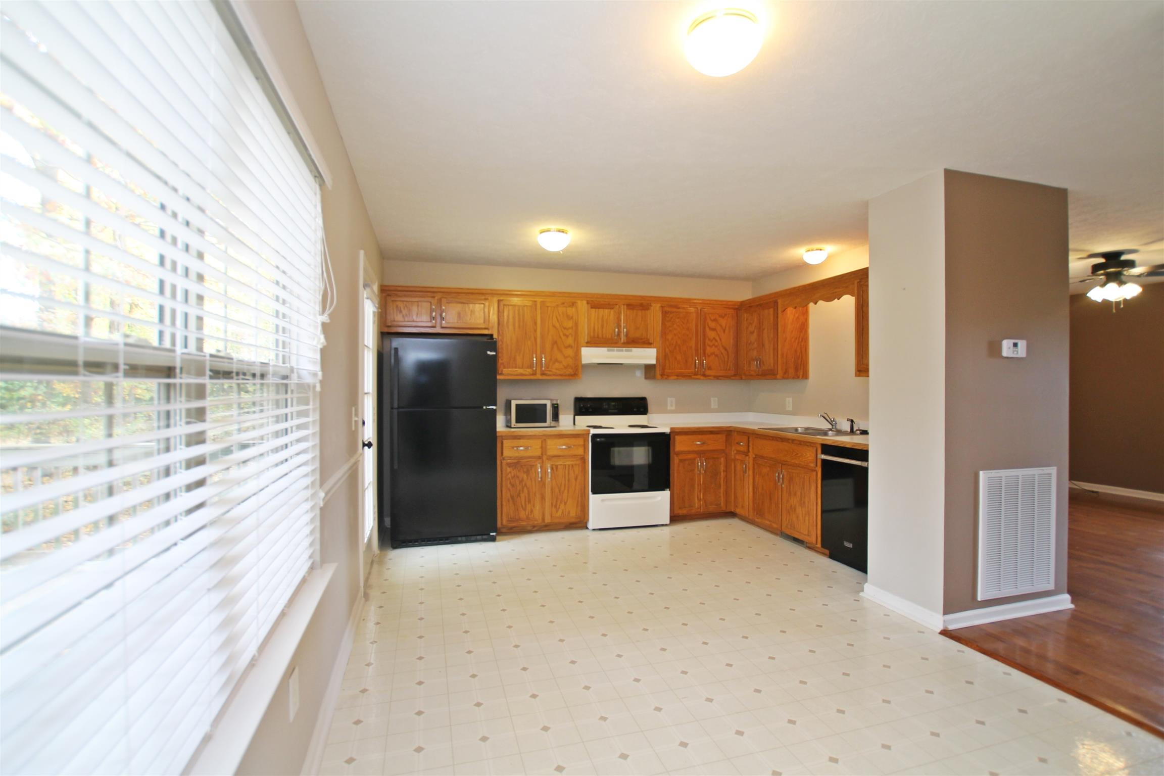 808 Hunters Crossing Lane Springfield, TN 37172 - Photo 9 of 30 a kitchen with stainless steel appliances granite countertop a refrigerator and a sink