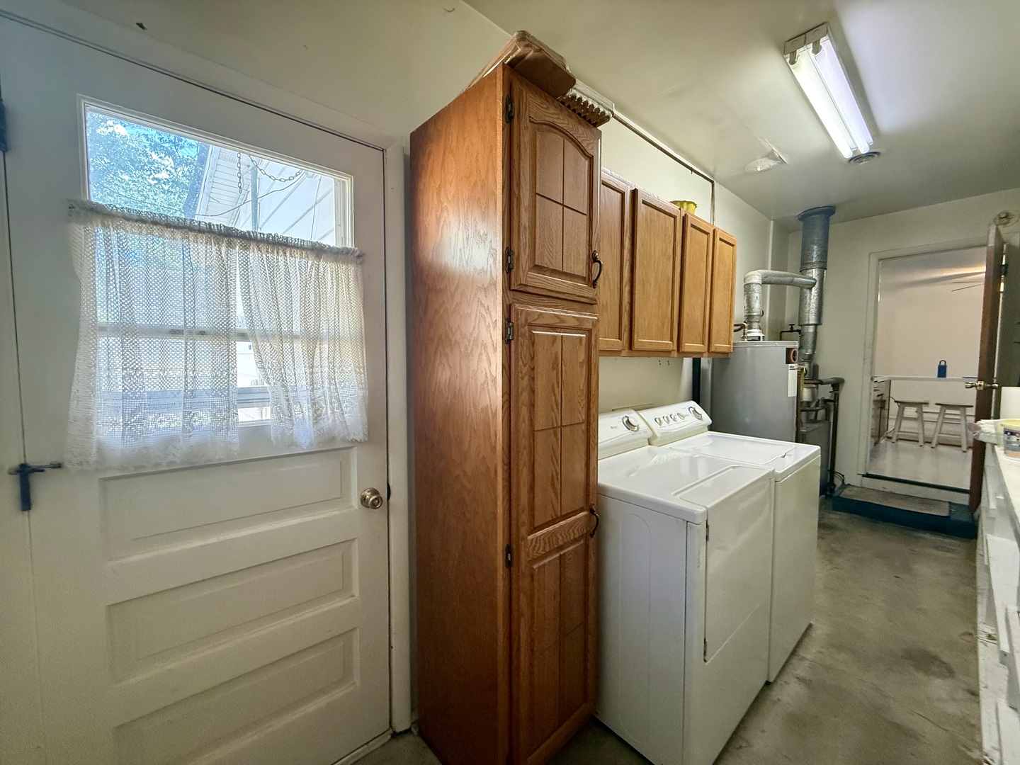 1340 Jeffrey Drive Rantoul, IL 61866 - Photo 16 of 18 a bathroom with a sink a mirror and a shower