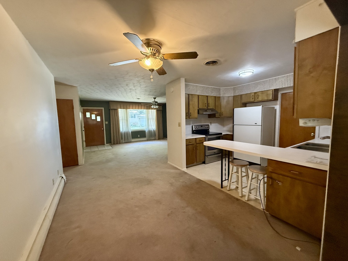 1340 Jeffrey Drive Rantoul, IL 61866 - Photo 3 of 18 a open kitchen with cabinets a sink and stainless steel appliances