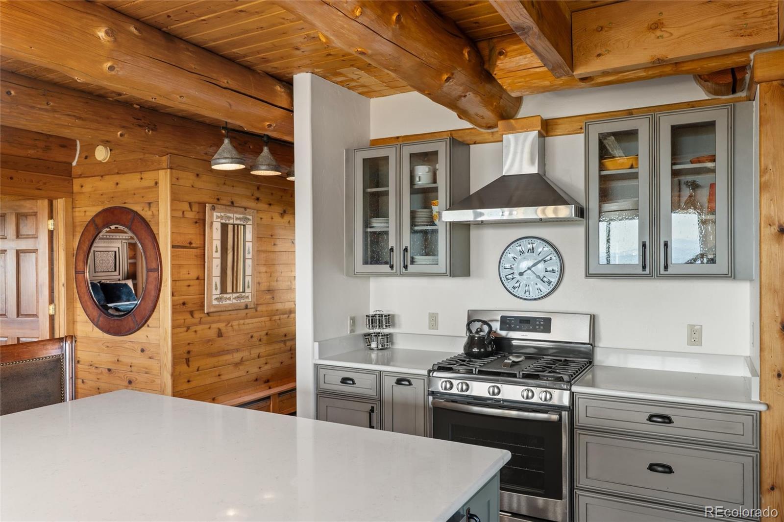 1853 County Road Kremmling, CO 80459 - Photo 26 of 50 a kitchen with a stove and a white refrigerator