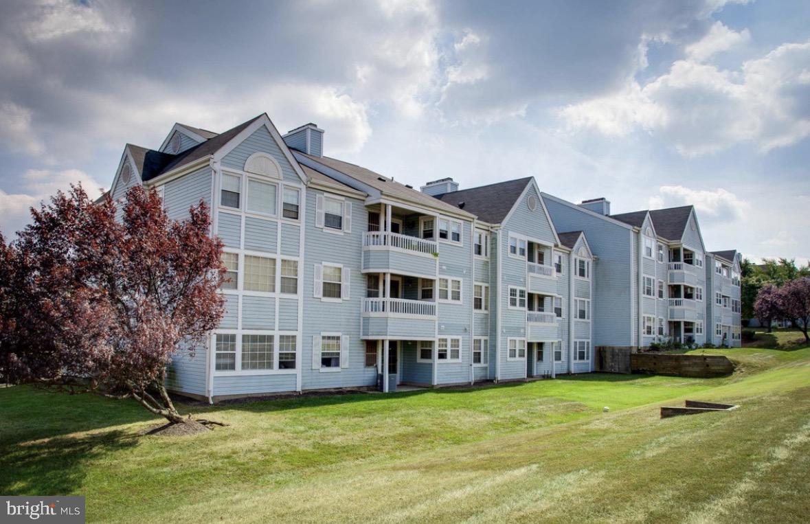 8503 Falls Run Road, Unit B Ellicott City, MD 21043 - Photo 2 of 23 Charming apartment complex with greenery.