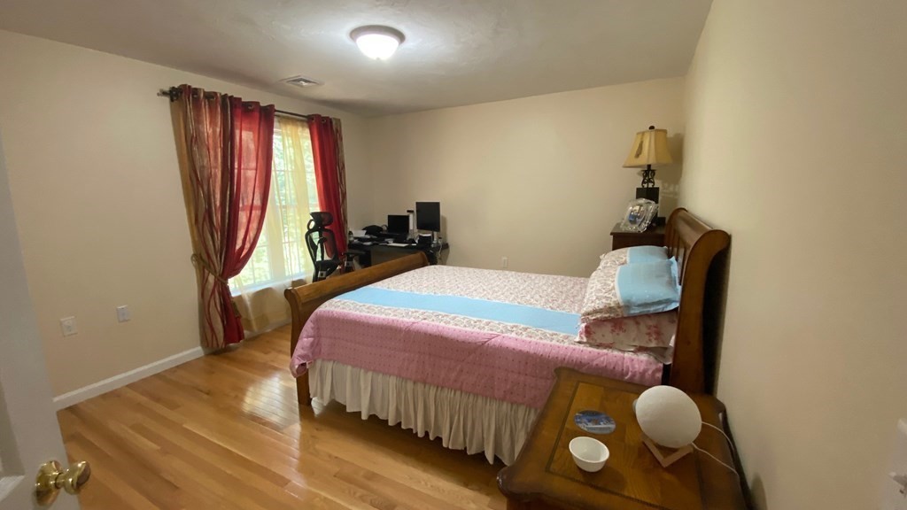 73 Zain Circle, Unit 73 Milford, MA 01757 - Photo 6 of 16 a bedroom with bed and a window