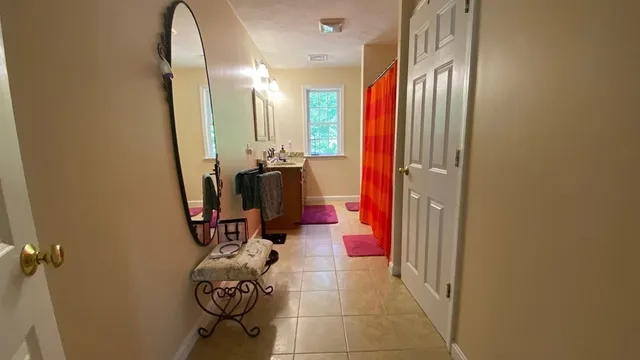 a view of walk in closet with clothes