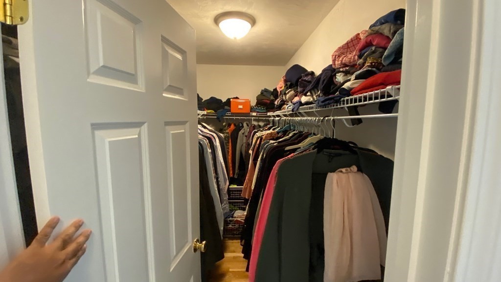 73 Zain Circle, Unit 73 Milford, MA 01757 - Photo 8 of 16 a view of walk in closet with clothes