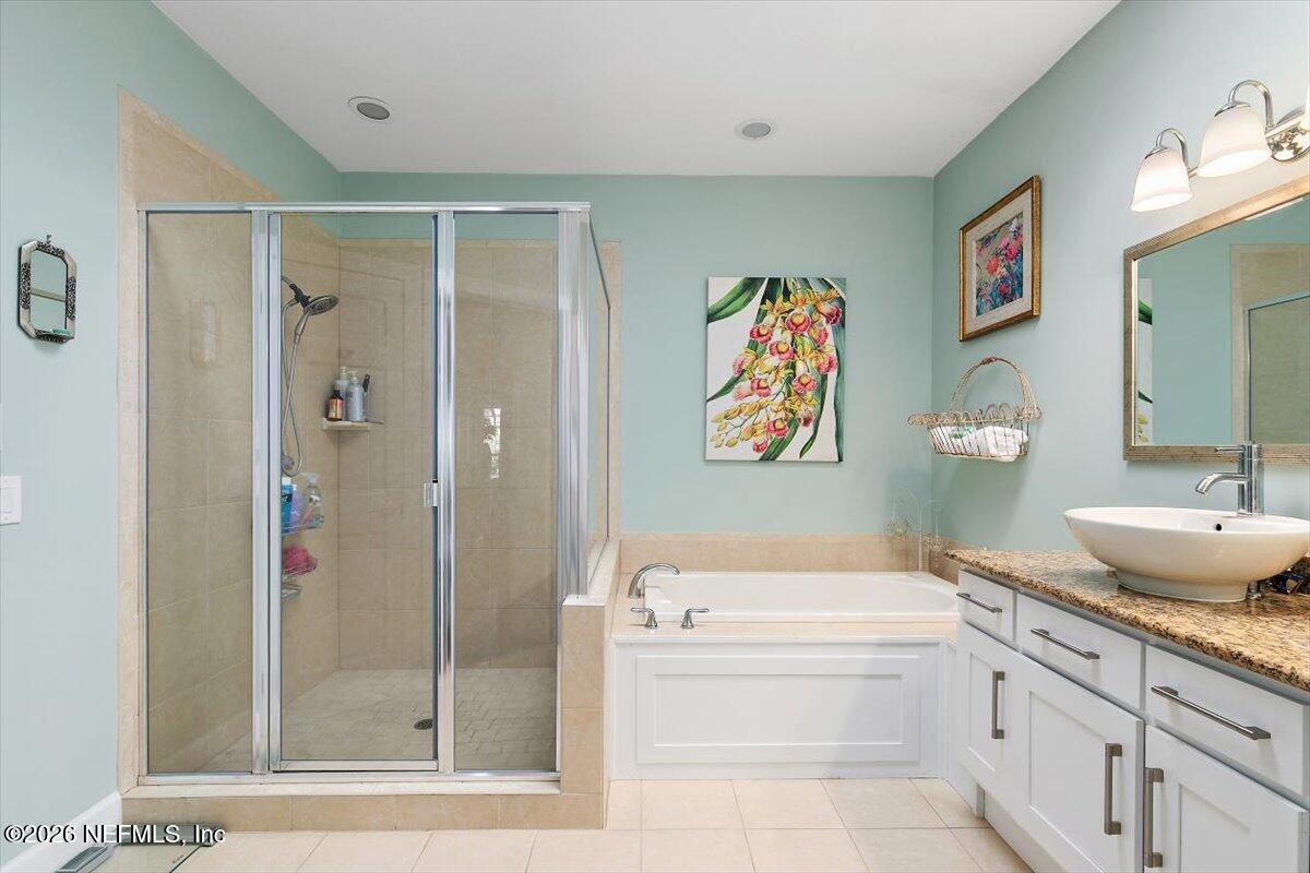 189 Laurel Lane Ponte Vedra Beach, FL 32082 - Photo 12 of 31 a bathroom with a granite countertop tub sink and mirror