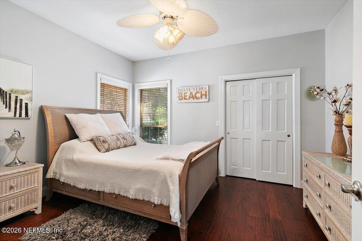 189 Laurel Lane Ponte Vedra Beach, FL 32082 - Photo 14 of 31 a bedroom with a bed and a chandelier