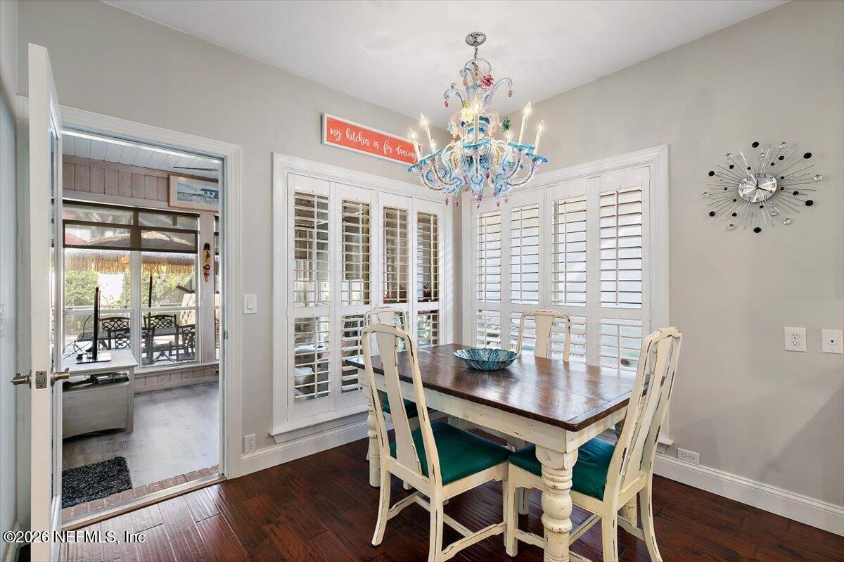 189 Laurel Lane Ponte Vedra Beach, FL 32082 - Photo 19 of 31 a dining room with furniture a chandelier and wooden floor