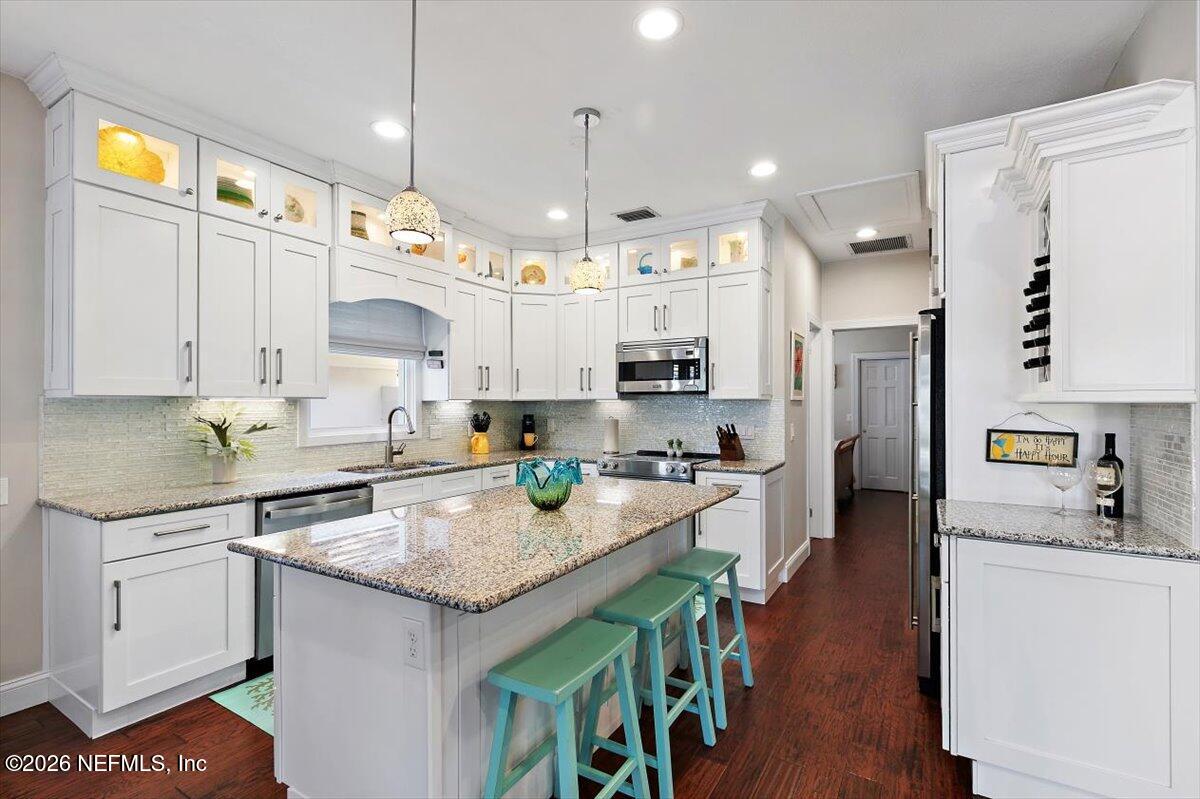 189 Laurel Lane Ponte Vedra Beach, FL 32082 - Photo 22 of 31 a kitchen with stainless steel appliances granite countertop a sink a stove and a refrigerator