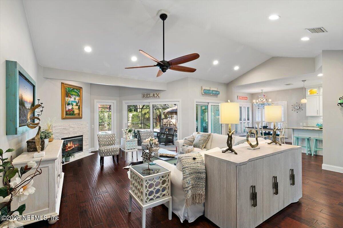 189 Laurel Lane Ponte Vedra Beach, FL 32082 - Photo 24 of 31 a very nice looking living room with a dining table wooden floor and a ceiling fan