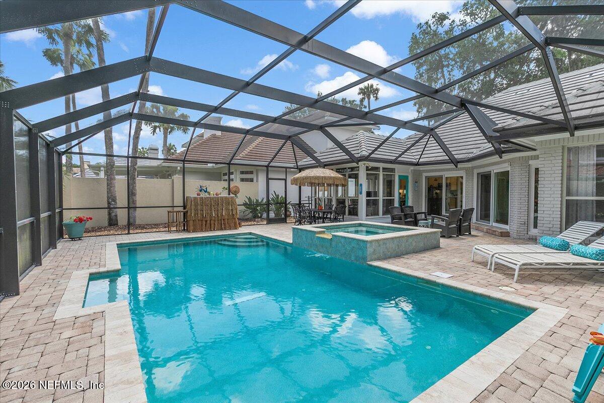 189 Laurel Lane Ponte Vedra Beach, FL 32082 - Photo 5 of 31 a view of a swimming pool with a patio
