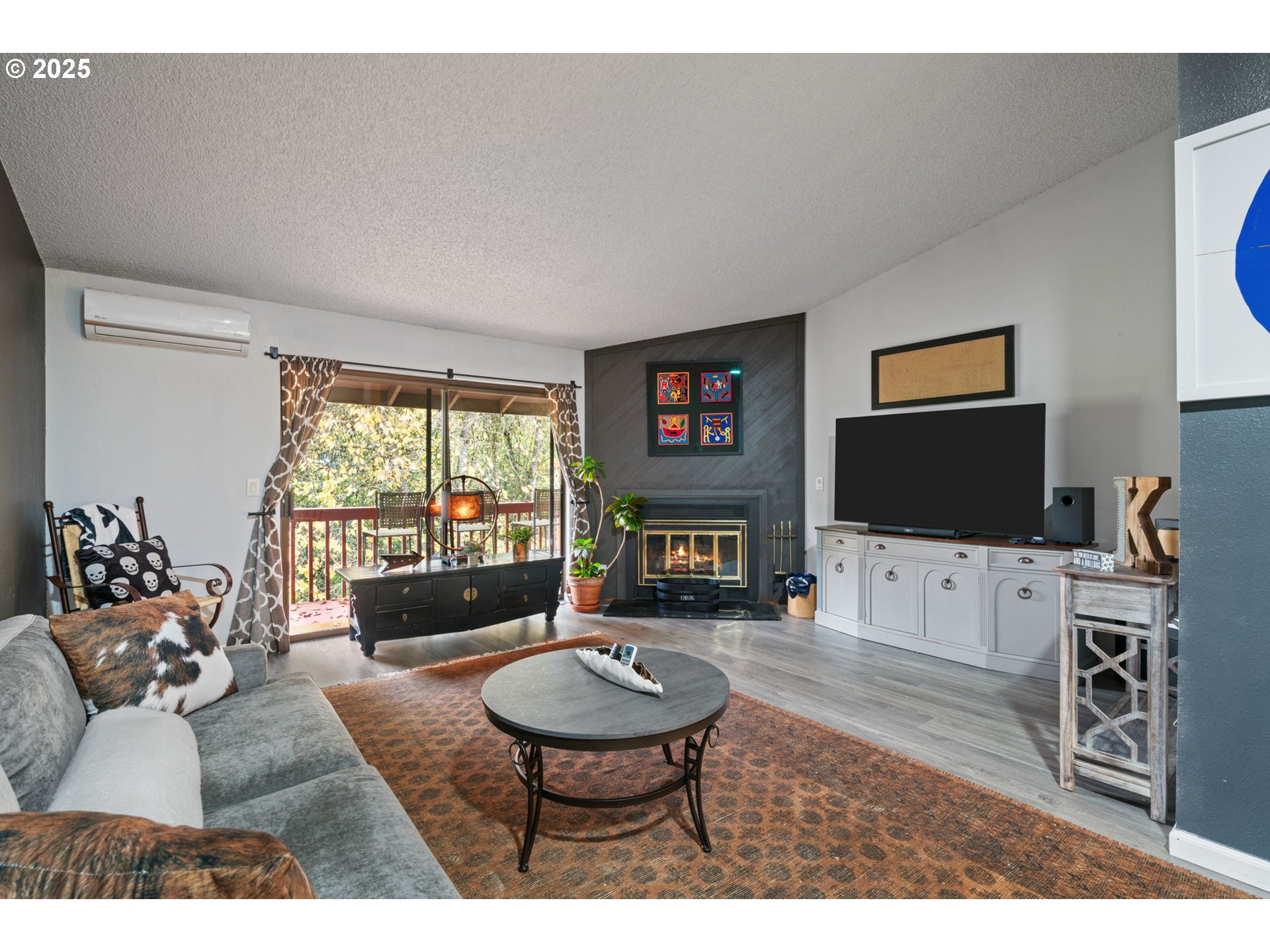 2818 Tree Top Lane West Linn, OR 97068 - Photo 15 of 46 a living room with furniture a flat screen tv and a large window