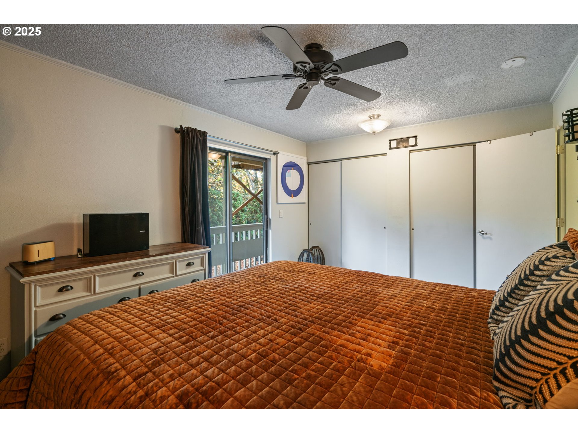 2818 Tree Top Lane West Linn, OR 97068 - Photo 23 of 46 a bedroom with a bed and a flat screen tv