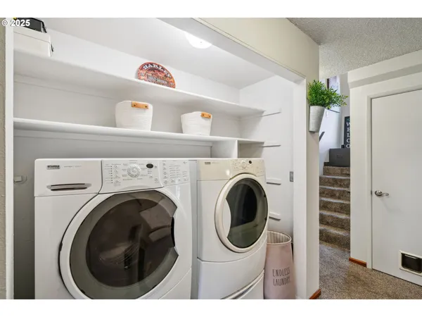 a view of livingroom with washer and dryer