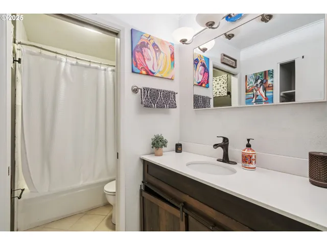 a bathroom with a sink a mirror and a toilet