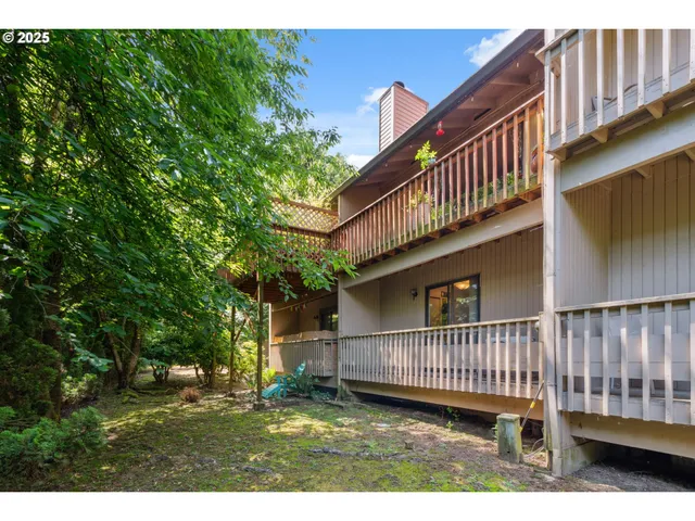 a view of a porch with a small yard