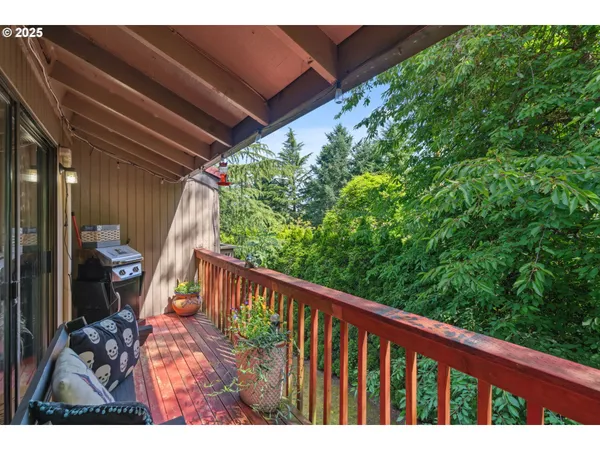a view of balcony with furniture