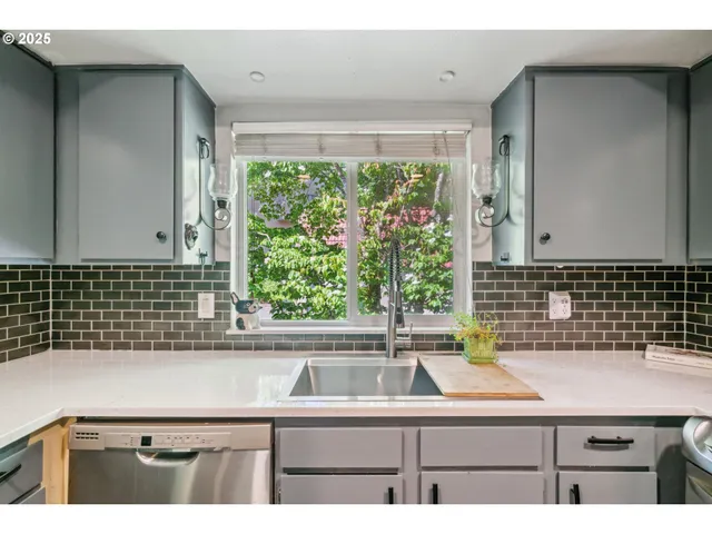 a bathroom with a sink and a window