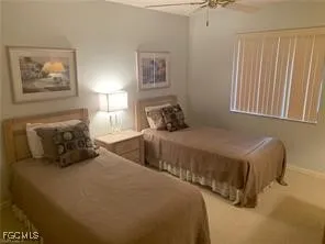 a bedroom with a bed and a lamp