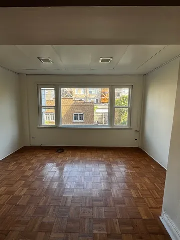 a view of an empty room and window