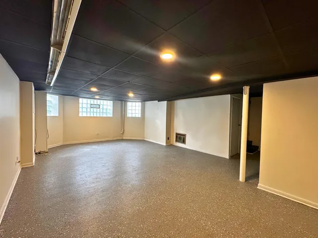 a view of an empty room with windows