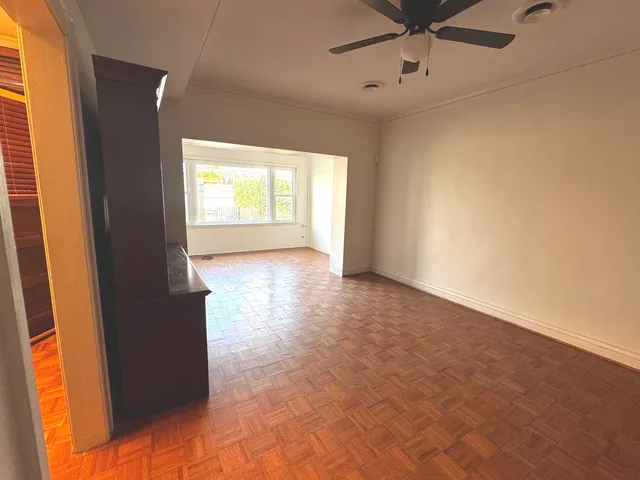 a view of an empty room with a window