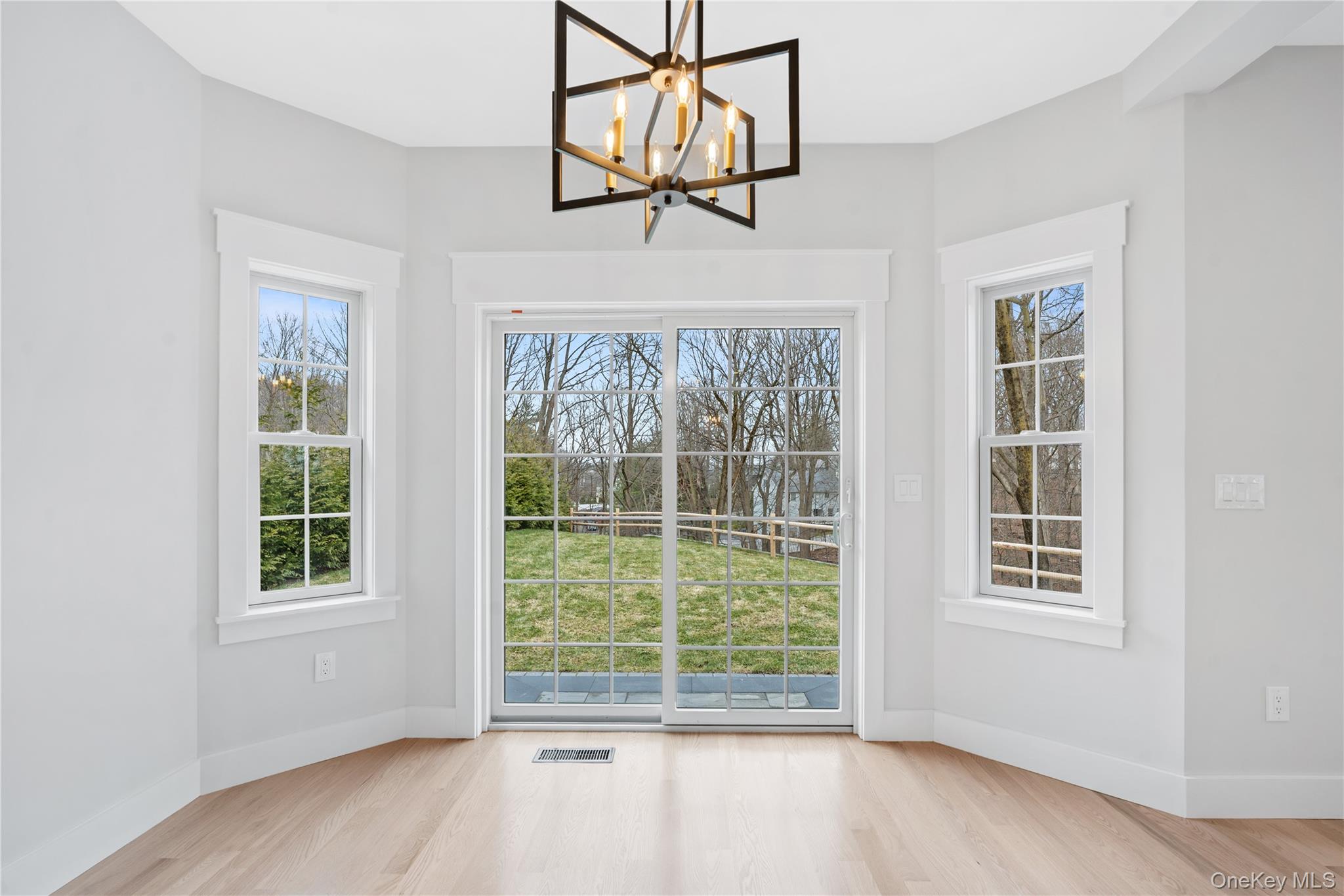 16 Stephens Lane Valhalla, NY 10595 - Photo 14 of 47 a view of a room with wooden floor and windows