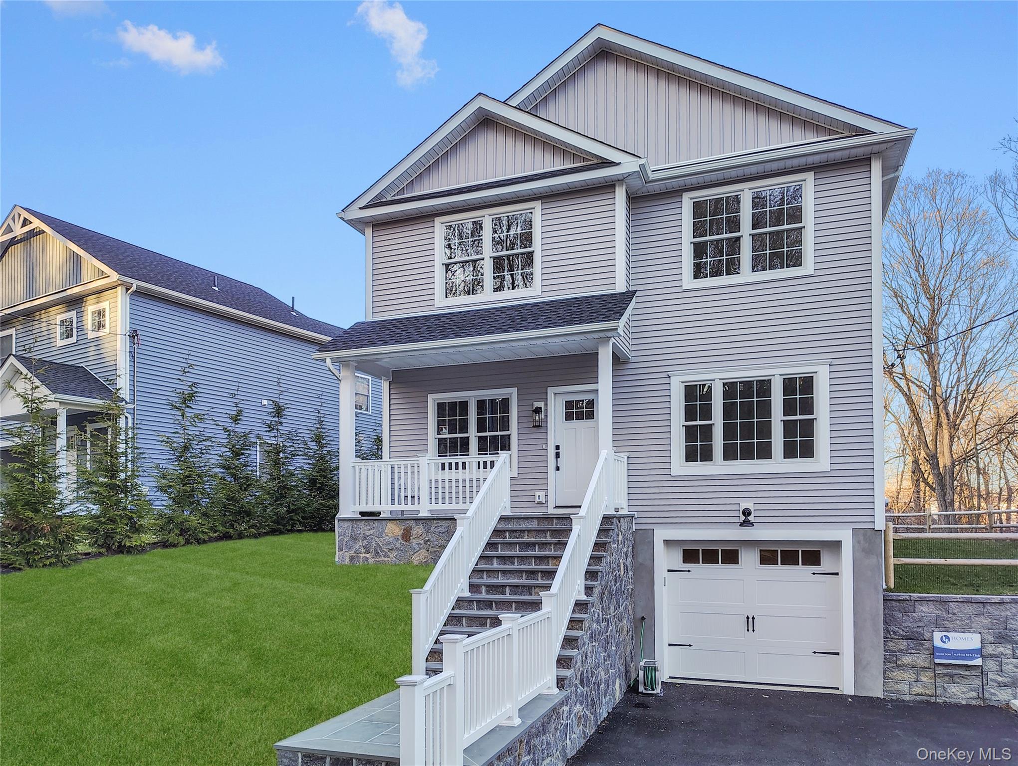 16 Stephens Lane Valhalla, NY 10595 - Photo 2 of 47 a front view of a house with a yard