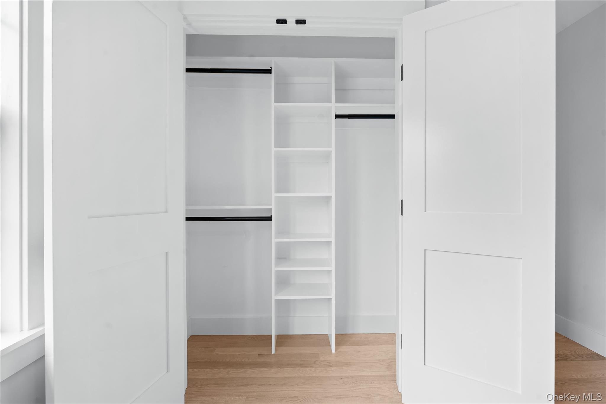16 Stephens Lane Valhalla, NY 10595 - Photo 23 of 47 a view of walk in closet with empty racks