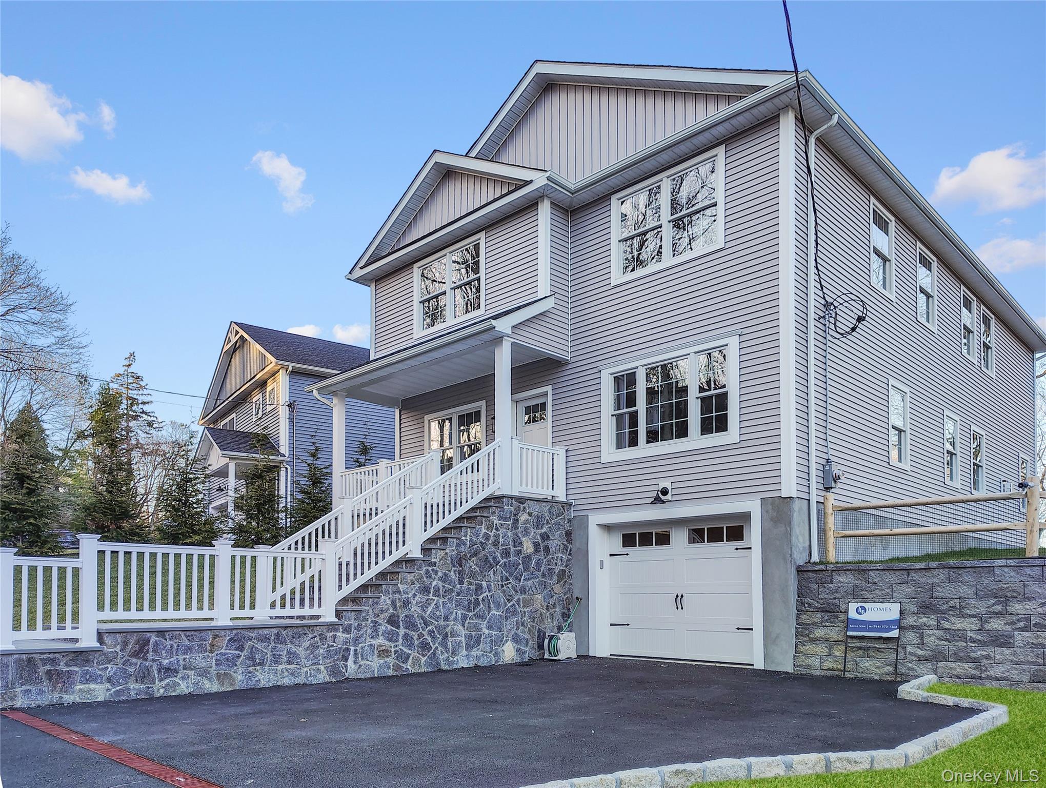 16 Stephens Lane Valhalla, NY 10595 - Photo 3 of 47 a front view of a house with a yard
