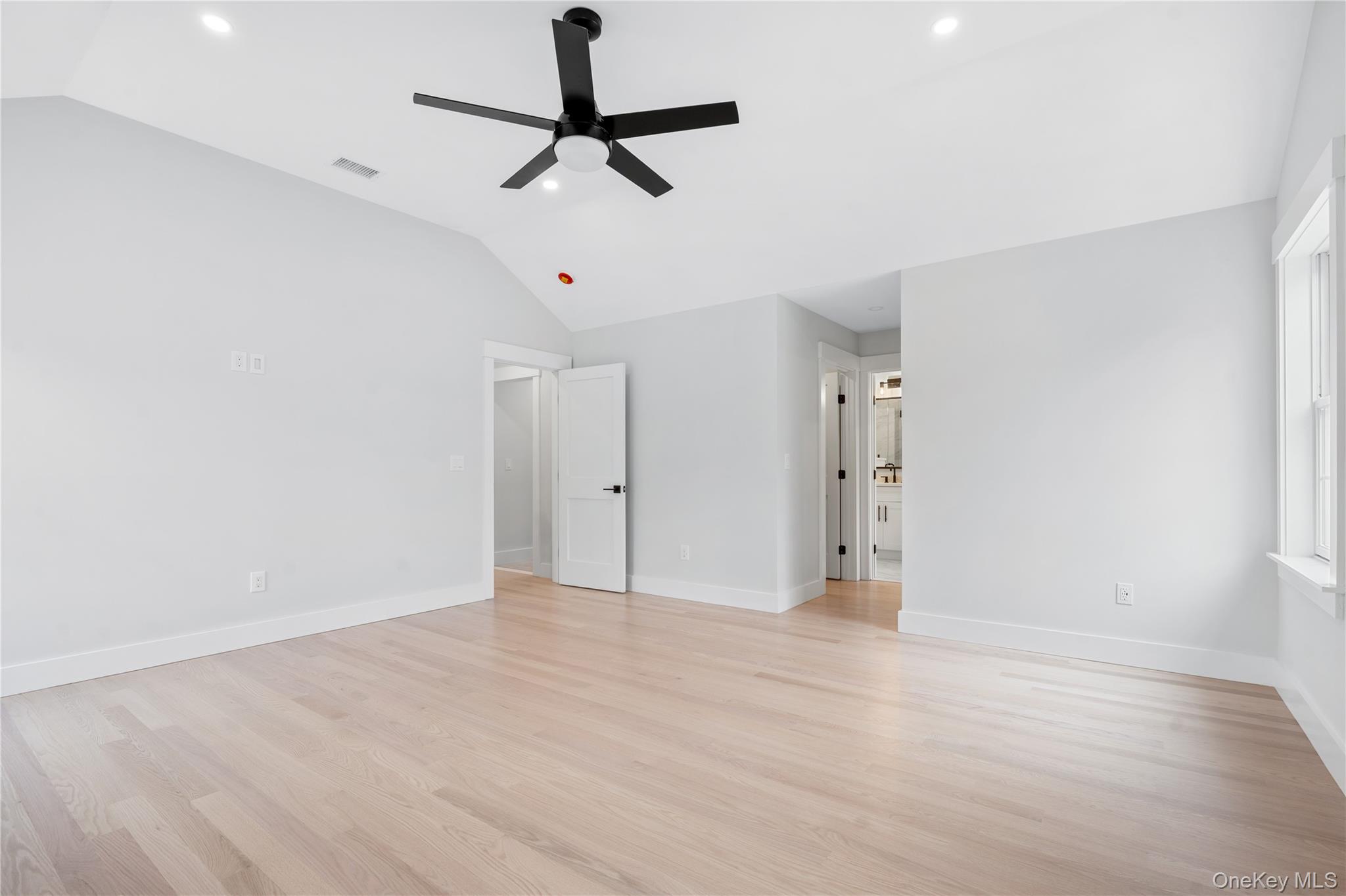 16 Stephens Lane Valhalla, NY 10595 - Photo 32 of 47 a view of an empty room with wooden floor