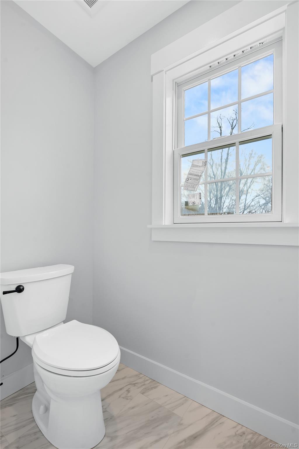 16 Stephens Lane Valhalla, NY 10595 - Photo 38 of 47 a white toilet sitting next to a window