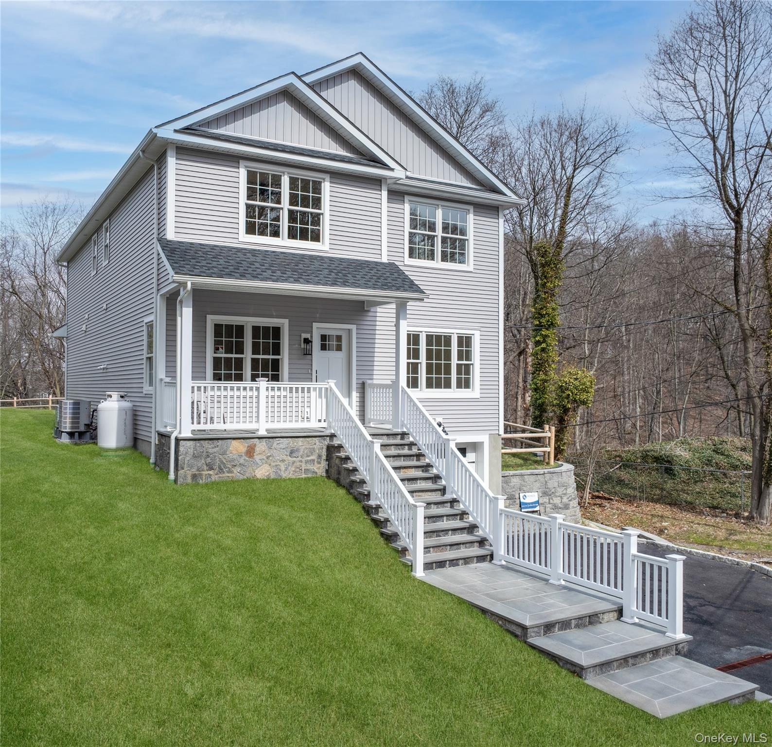 16 Stephens Lane Valhalla, NY 10595 - Photo 4 of 47 a front view of a house with a yard