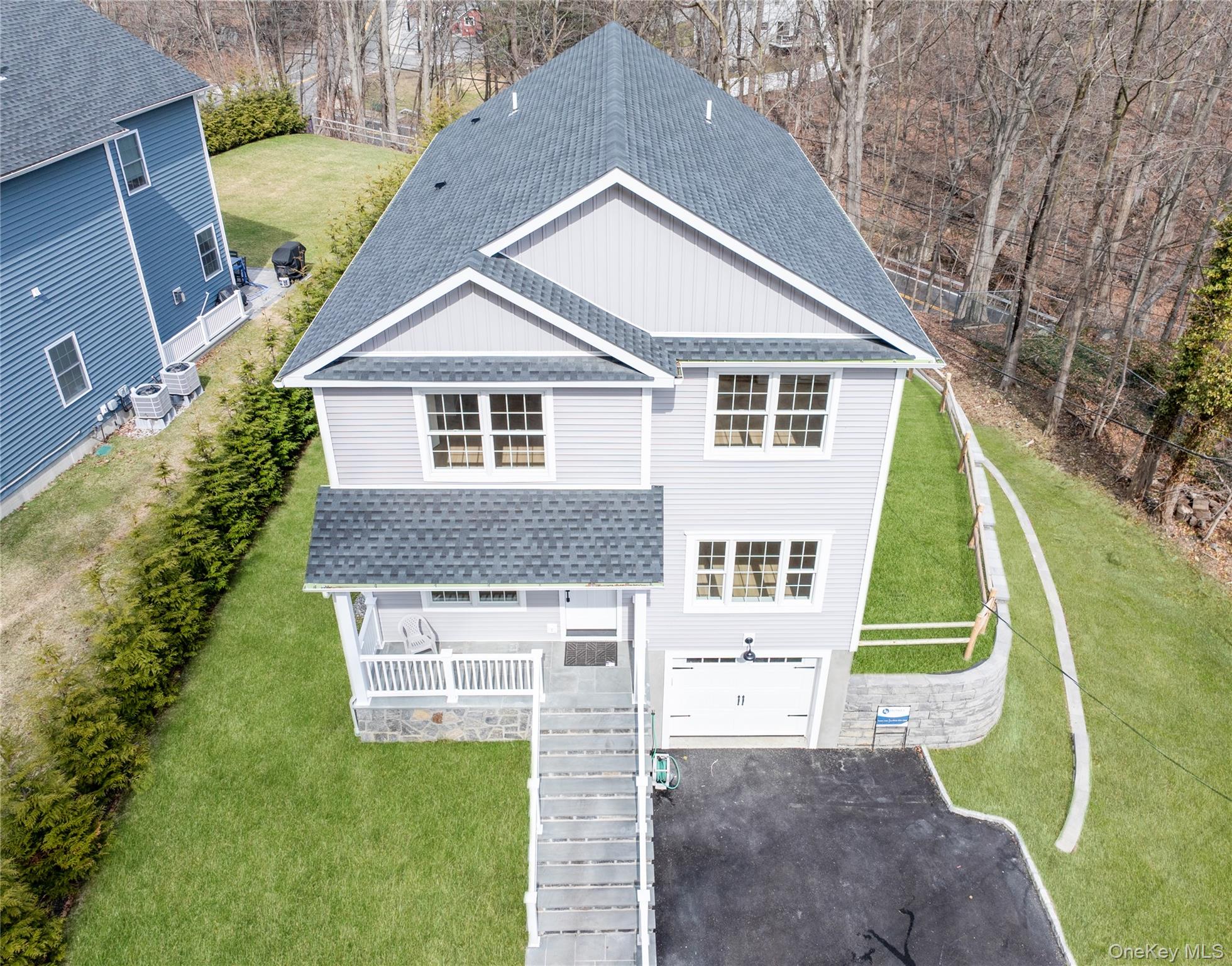16 Stephens Lane Valhalla, NY 10595 - Photo 43 of 47 a aerial view of a house with a yard