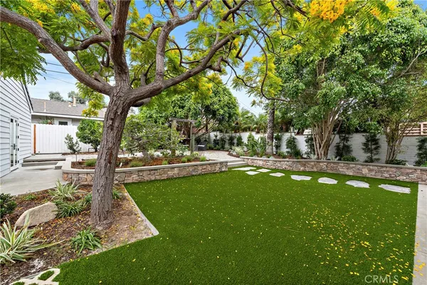 a living room with furniture fireplace and a large window