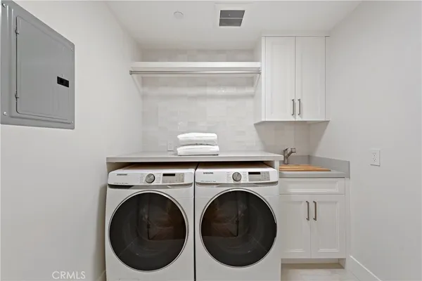 a bedroom with a large bed and a large window