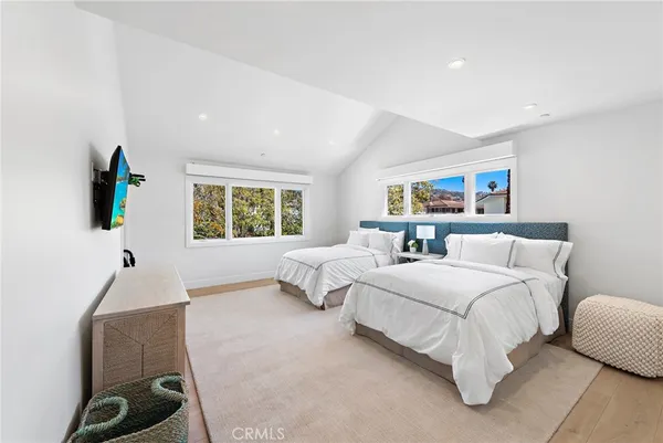 a bathroom with double vanity sinks double vanity tub and a mirror