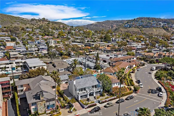 a view of a city street with cars