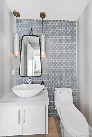 an aerial view of a house with a yard and balcony