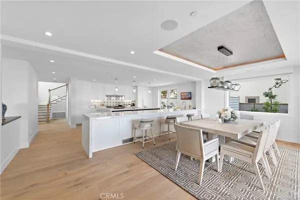 a living room with furniture large window and fireplace